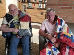 Quilts of Valor® recipients Richard (Rick) Urvand (left) and Mark Olson.