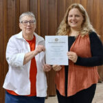 Marquita Novak (left) receiving award from Candace Berg. Photo courtesy: Candace Berg, IceBerg Art