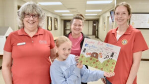 Front (l-r): Susan Degner, Department Treasurer; Ms. Kain Lee, and Laura Rutherford, Unit 147 Poppy Chairman, Back: Kyann Lee (Kain’s mother).