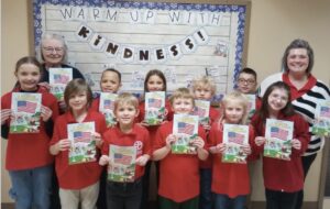 Americanism in the Schools Ruth Quam, President of Hafner-Miller-Ross Unit 20 of Wahpeton, presented “I Pledge Allegiance” booklets to students at St John’s School on January 15, 2026. Ruth is pictured in the back row (left) with School Principal Kaja Kaste, back row (right) and some of the students who received the colorful booklets.
