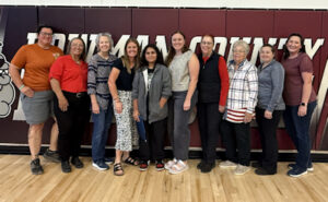 Pictured (l-r): Auxiliary members Anne Gruber; Donna Robinson; Cindy Miller; Lisa Halstrom, instructor; Natalia Martinez, contest winner; Jaci Myrnak, instructor; Terry Freymiller; Carol Miller; Devin Anderson; and Laci Coates, Bowman County Veterans Service Officer.