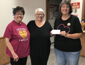 Gackle Food Pantry Donation. Pictured (l-r): Gackle Food Pantry representatives Jane Schoonover, District 4 President and Peggy Schroeder with Elaine Ackerman, President Unit 250.