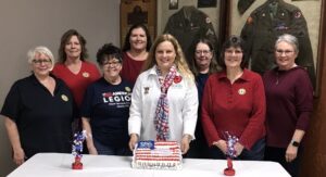large group photo - Front Row (l-r): Auxiliary members: Peggy Schroeder; Jane Schoonover, President District 4; Candace Berg, Department President; Elaine Ackerman, President Unit 250; Rosi Long. Back Row (l-r): Marella Koenig, Patty Moos, Judy Schultz.