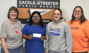 International Music Camp Scholarship recipients. Pictured (l-r): Elaine Ackerman, Unit President; Alexa Dominguez and Maci Griffith, Gackle-Streeter High School students; and Corinne Muller, Gackle-Streeter High School Music Instructor.