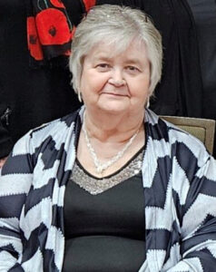 Charlotte Lassonde – Department Chairman - lady with silver hair and dresses in black and white